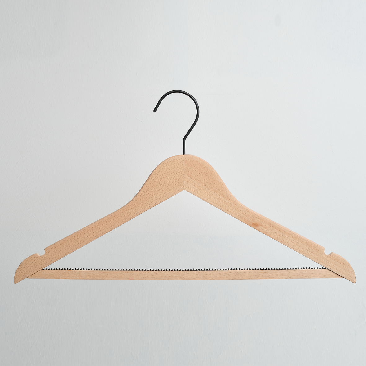 A Hangers of London Luxury FSC Certified Beech Wooden 42cm Top Hanger with a trouser bar and black metal hook, photographed against a plain white background.
