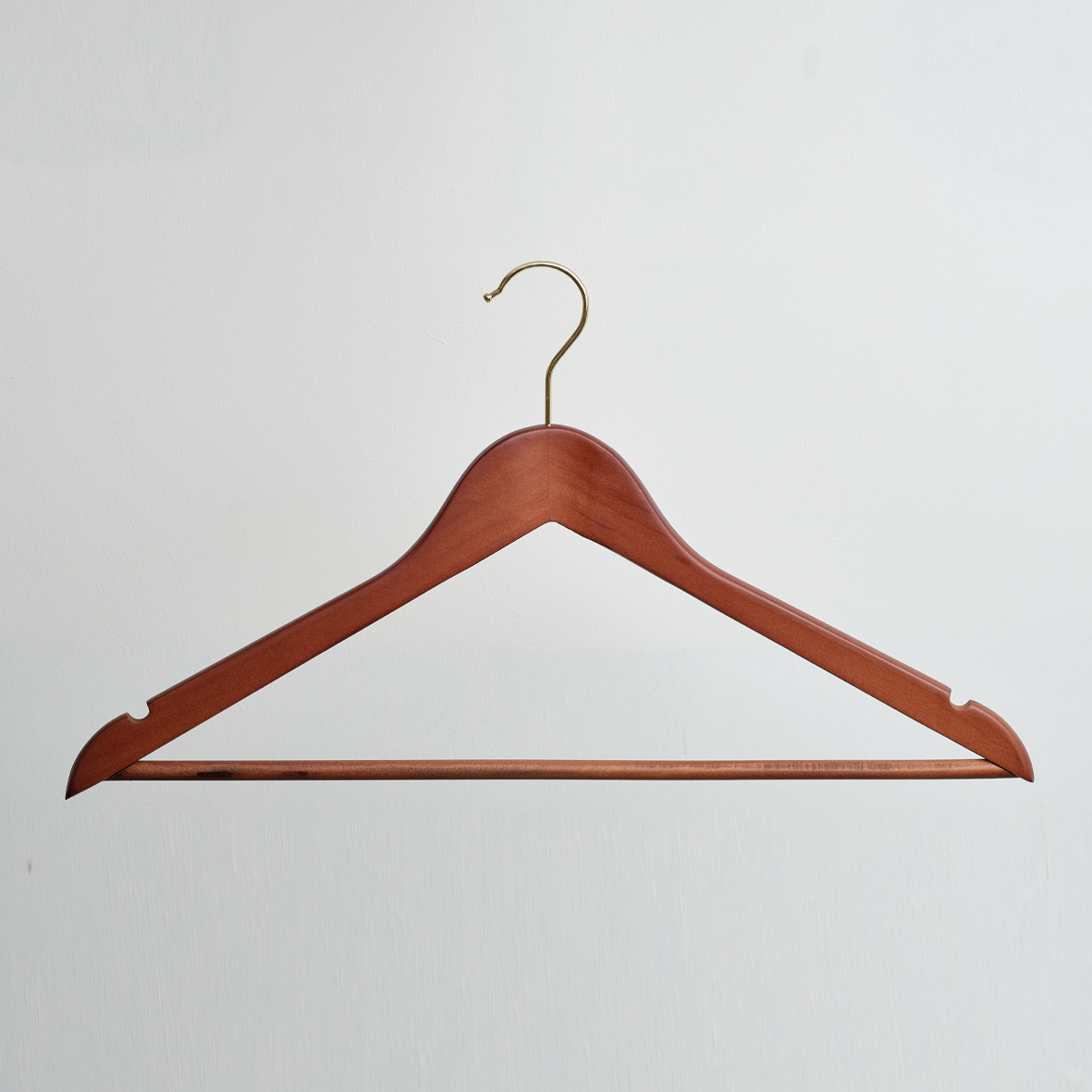 A Hangers of London Dark Wooden 45cm Top Hanger with Trouser Bar and Gold Hardware is displayed against a plain white background.