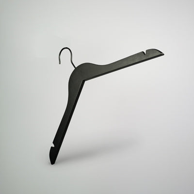 A sleek, black wooden top clothes hanger with a slanted design and hook on top is set against a plain, light-colored background. The Hangers of London Black Wooden Top Clothes Hanger with Notch 38cm ensures straps are securely held, and its contoured shape is ideal for various garments.