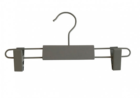 A Grey Wooden Kids Clip Bottom Hanger 26cm from Hangers of London featuring a hook at the top and two adjustable clips on each end, perfect for hanging children's pants or skirts. The central bar is covered with gray, rectangular padding. Made from eco-friendly wood, this hanger is set against a plain white background.