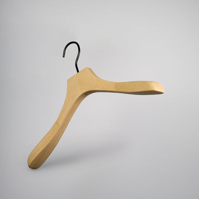 The Hangers of London Premium Natural Wooden Top Jacket Hanger 39cm, featuring broad curved shoulders and a black metal hook, is displayed against a plain light gray background.