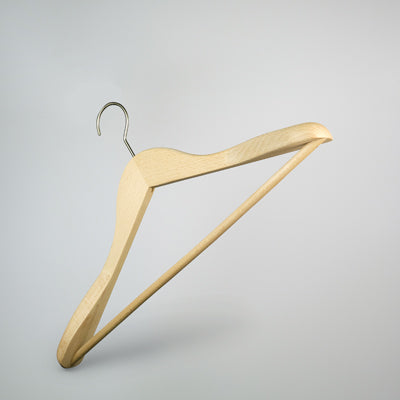 A **Hangers of London Natural Wooden Jacket Hanger with Trouser Bar 44cm** with a silver metal hook, designed for hanging clothes. This high-quality hanger features a smooth, natural wood finish and a contoured shape suitable for shirts, jackets, or dresses. The background is plain and light grey, emphasizing the simplicity of the design.