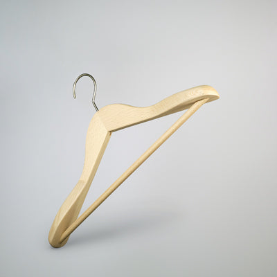A Hangers of London Natural Wooden Jacket Hanger with Trouser Bar 39cm is suspended in mid-air against a light gray background. The design is minimalist and functional, perfect for efficient closet organization.