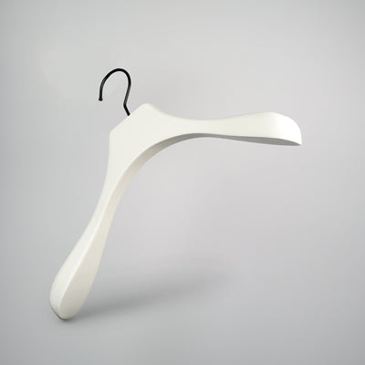 A sleek, modern White Wooden Jacket Top Coat Hanger 38cm by Hangers of London with a curved design and wide shoulders is depicted against a plain grey background. It features a black hook for hanging, making it perfect for use as a jacket hanger.