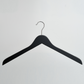 The image shows the Hangers of London 44cm Black Wooden Top Hanger with Non Slip Grips (Pack of 100), featuring a sleek black finish and a silver metal hook, displayed against a plain white background.