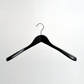 A Hangers of London Black Wooden 45 cm Jacket Hanger from a pack of 24 is displayed centered against a plain white background, featuring a silver hook.