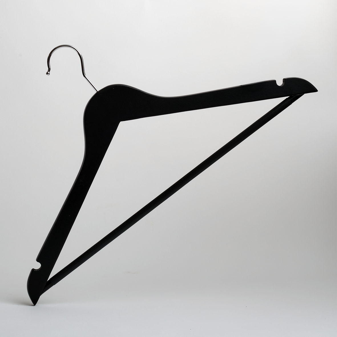 The image displays a Hangers of London Black 44cm Wooden Clothes Hanger With Non Slip Trouser Bar from their pack of 100, featuring a sleek black finish, sturdy metal hook, and a non-slip bar to keep garments securely in place—all set against a plain white background.