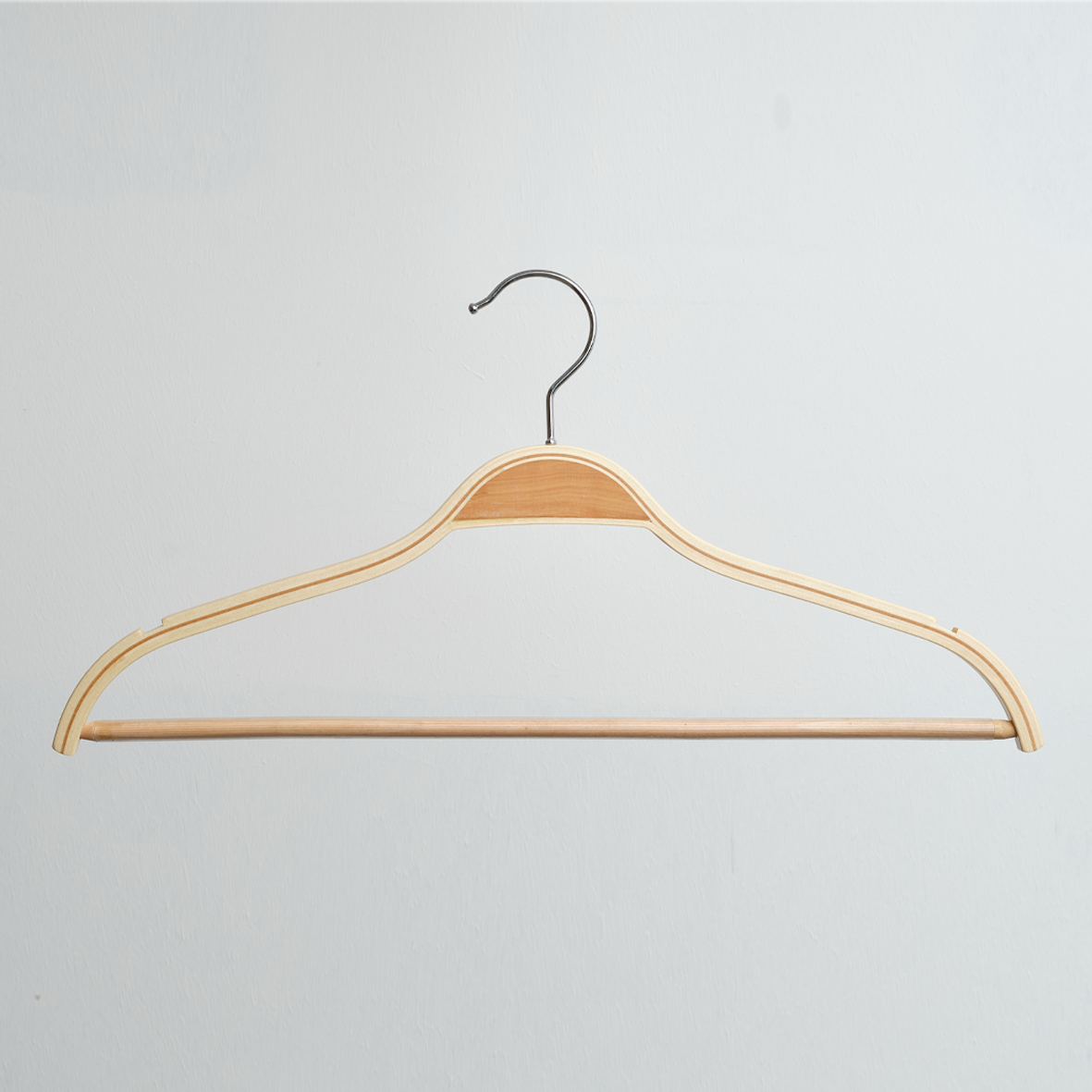 A Hangers of London Scandi Style Laminated Wooden 42cm Top Hanger With Trouser Bar is hanging against a plain white background.
