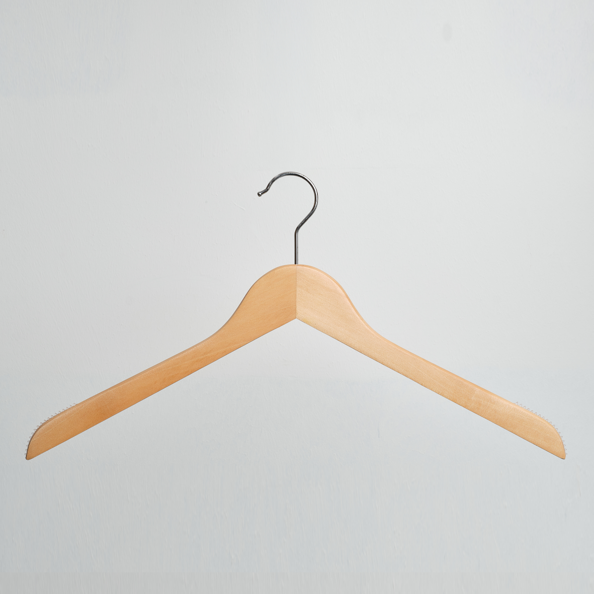 A Hangers of London Natural Wooden 44cm Top Hanger with non-slip grips, from a pack of 100, is centered against a plain white background.