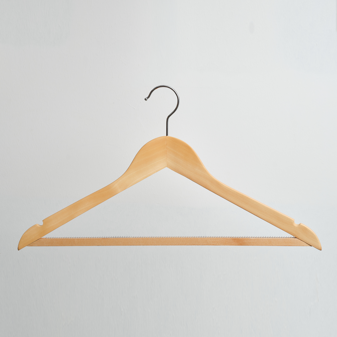 A Hangers of London Natural Wooden 44cm Top Hanger with Trouser Bar and Notches, shown with its metal hook against a plain white background (Pack of 100).