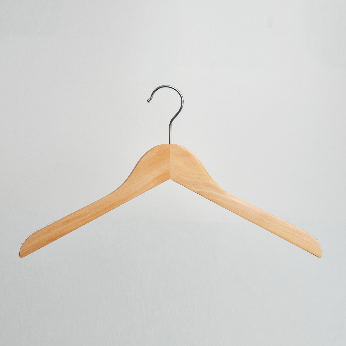 A Hangers of London Natural Wooden 38cm Top Hanger With Non-Slip Grips is suspended against a plain white background.