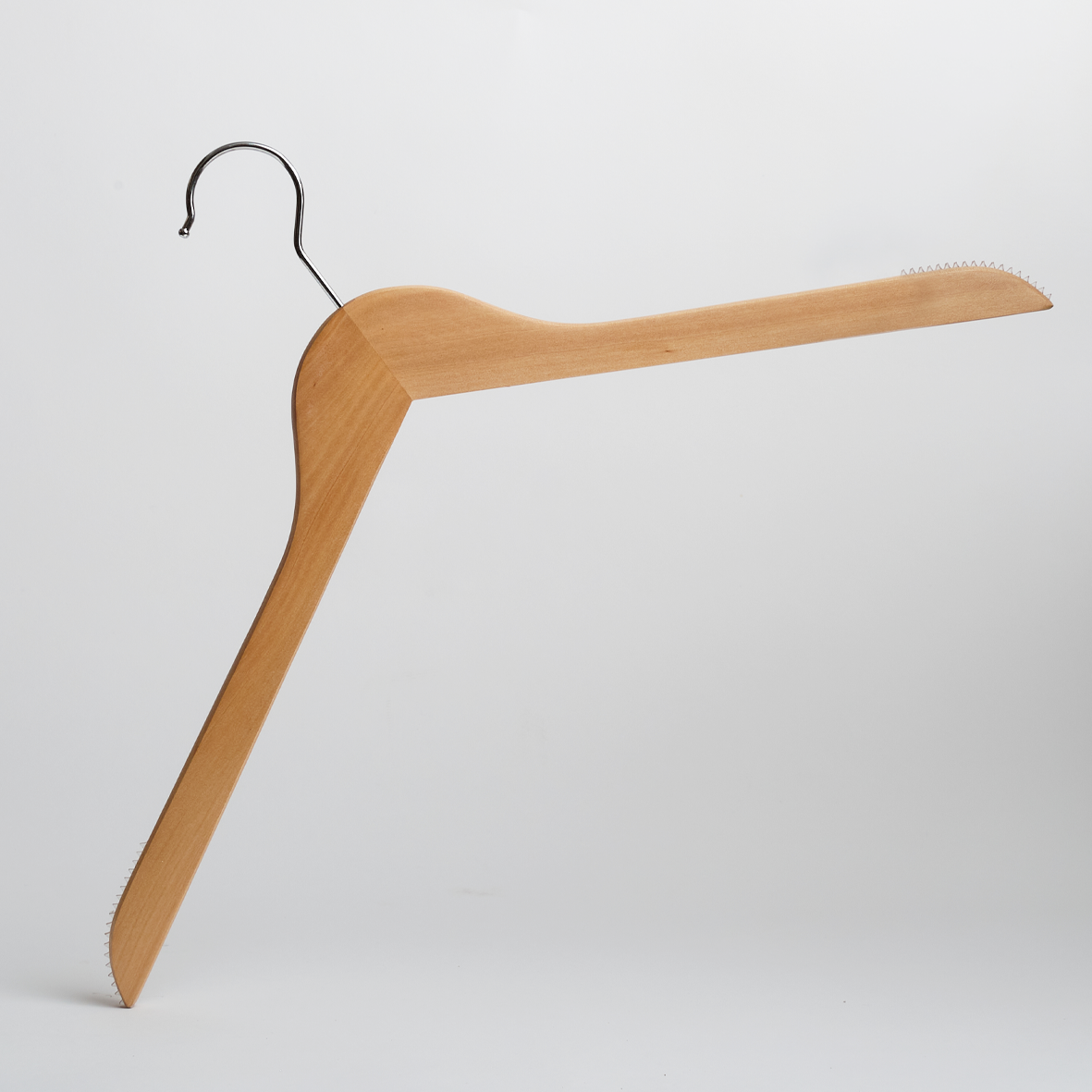 A “Hangers of London” Natural Wooden 44cm Top Hanger with non-slip grips, designed with one arm angled upward and the other downward—each end featuring small ridges—displayed against a plain white background (Pack of 100).