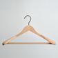 A Luxury FSC Certified Beech Wooden Jacket Hanger With Trouser Bar by Hangers of London is hanging against a white background.