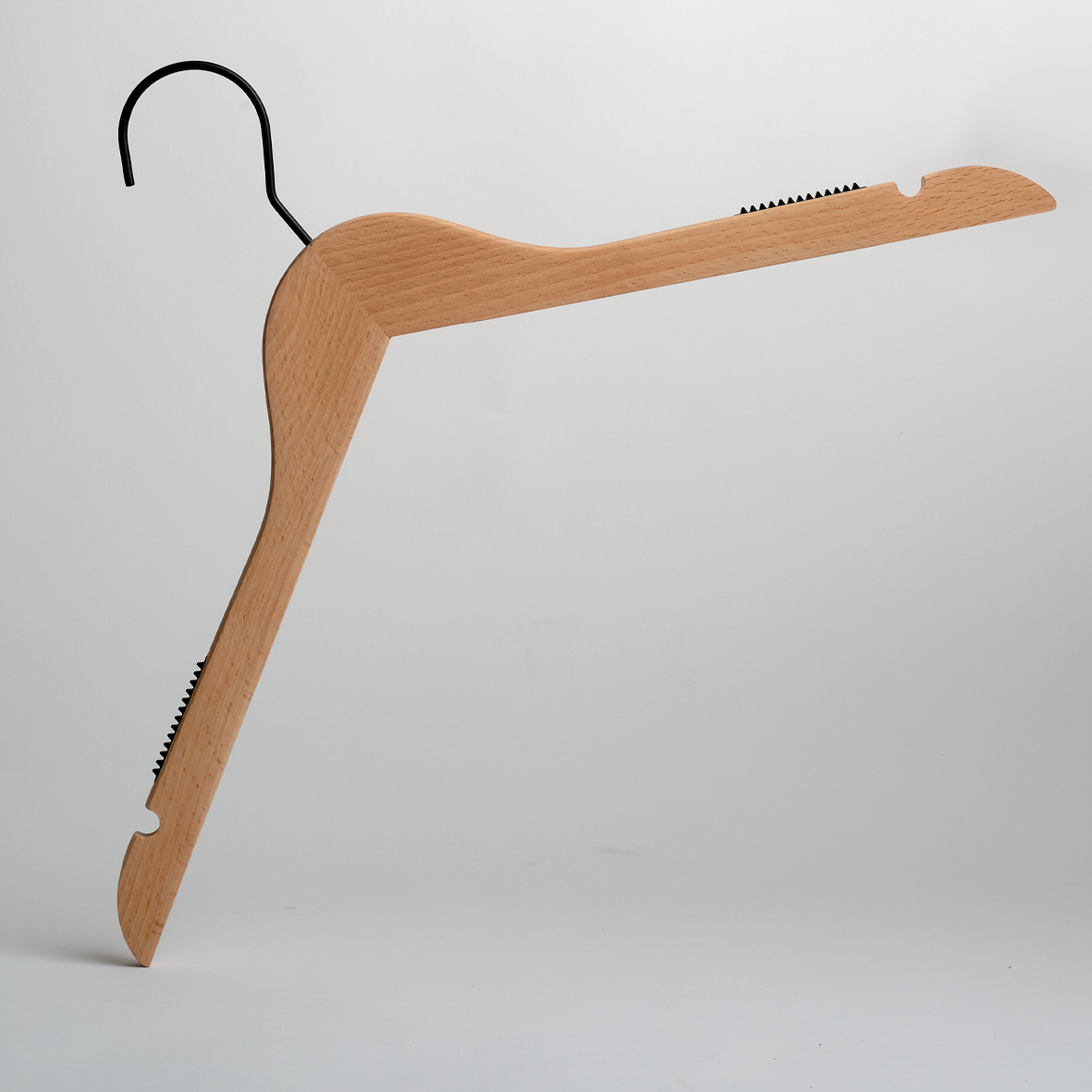 A Hangers of London Luxury FSC Certified Beech Wooden 42cm Top Hanger With Non-Slip Grips, featuring a black metal hook and standing upright on a white background. The hanger includes notches and ridges on both arms for securely gripping clothing.