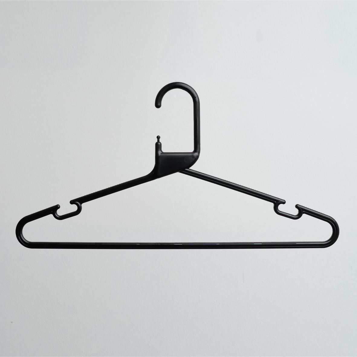 A Heavy Duty Economy Black Multi Purpose Rainbow Hanger from Hangers of London (part of a 300-pack) is displayed against a plain white background.