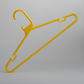 A Heavy Duty Economy Yellow Multi Purpose Rainbow Hanger by Hangers of London stands upright against a plain gray background. This plastic hanger features hooks on both sides and a curved top hook for easy hanging.