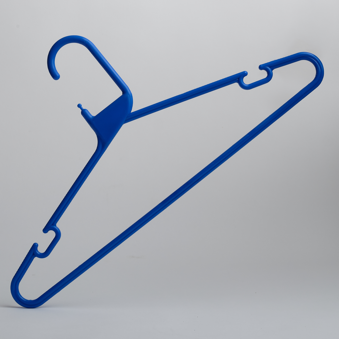 A Heavy Duty Economy Blue Multi Purpose Rainbow Hanger by Hangers of London, from a pack of 300, is displayed against a plain light gray background.