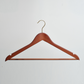 A Hangers of London Dark Wooden 45cm Top Hanger with Trouser Bar and Gold Hardware is displayed against a plain white background.