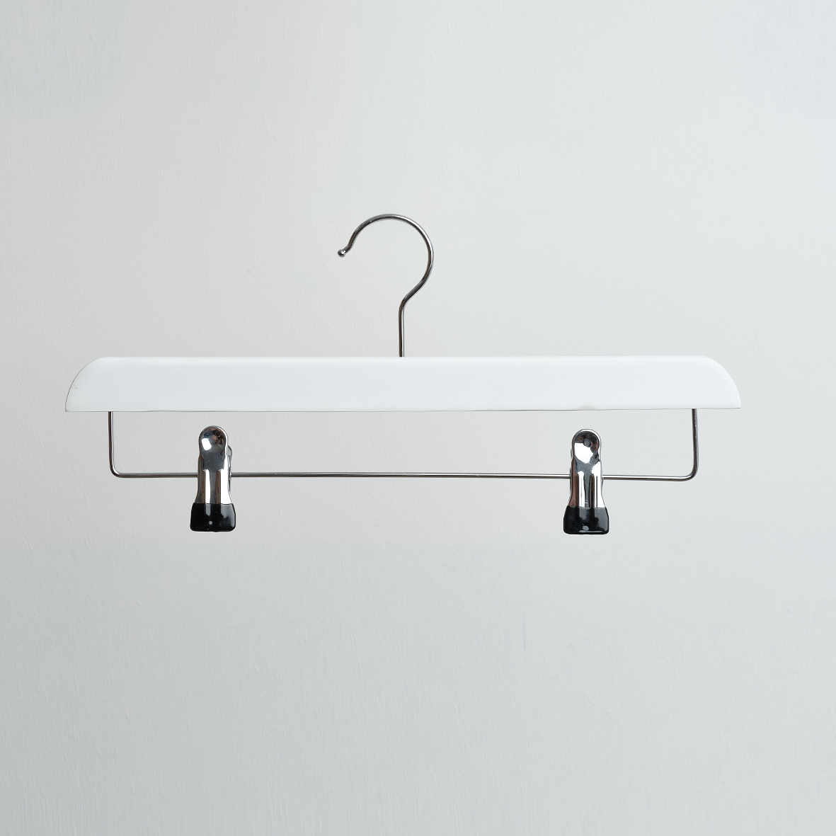 The Hangers of London White Wooden 35cm Clip Hanger is displayed hanging against a plain light gray background.