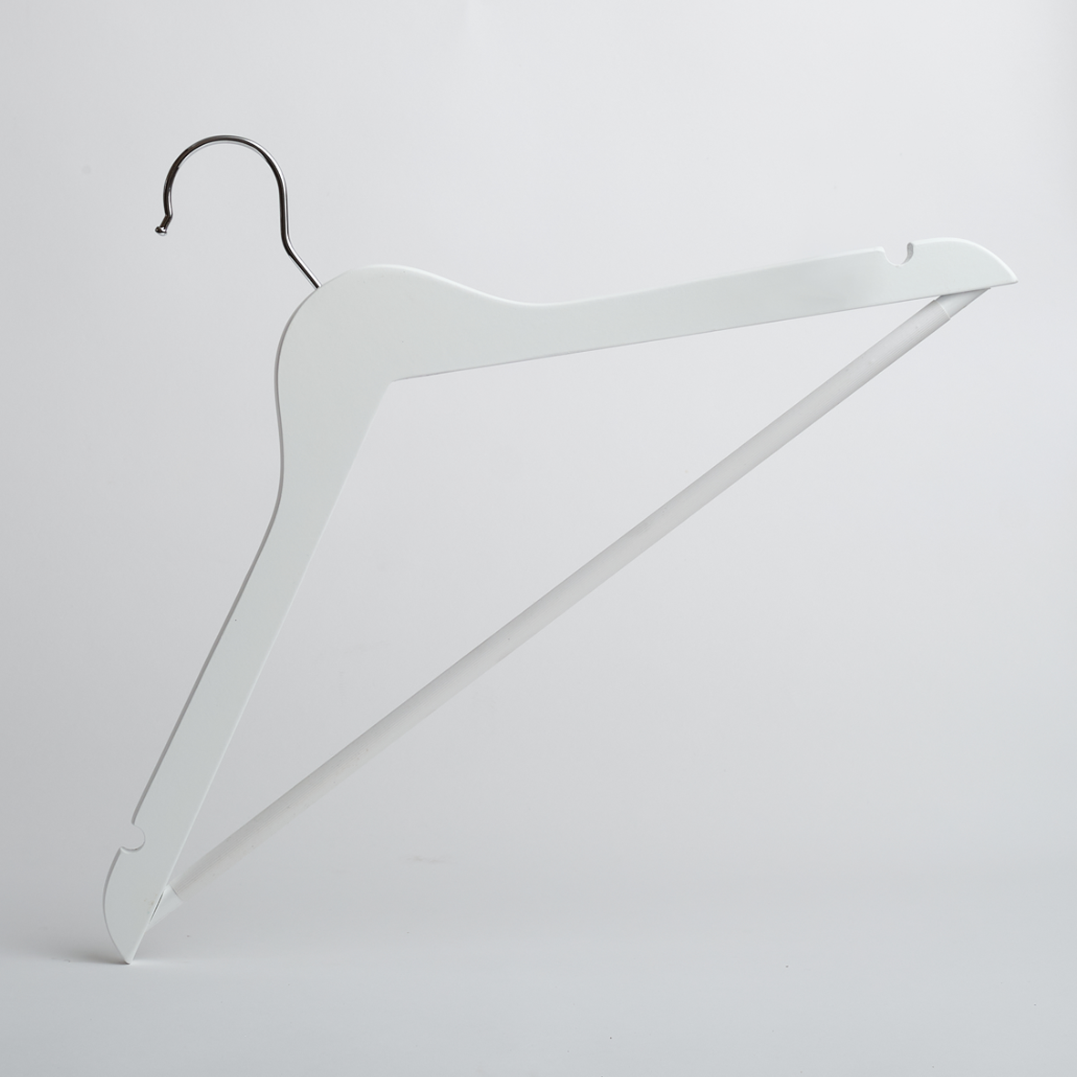 A Hangers of London White Wooden 44cm Top Hanger with a non-slip trouser bar is standing upright against a plain light gray background.