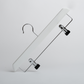 A Hangers of London White Wooden 35cm Clip Hanger, featuring two black clips, is positioned diagonally against a plain white background.
