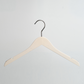 A Luxury Whitewashed Beech Wooden 42cm Top Hanger With Notches from Hangers of London is hanging against a light gray background.