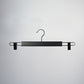 A Hangers of London Black Wooden Clip Bottom Hanger 37cm is centered against a plain, light-colored background. The hanger features a curved hook at the top that allows for 360 degree rotation, a straight bar in the middle, and metal clip extensions on either side to hold clothing securely.