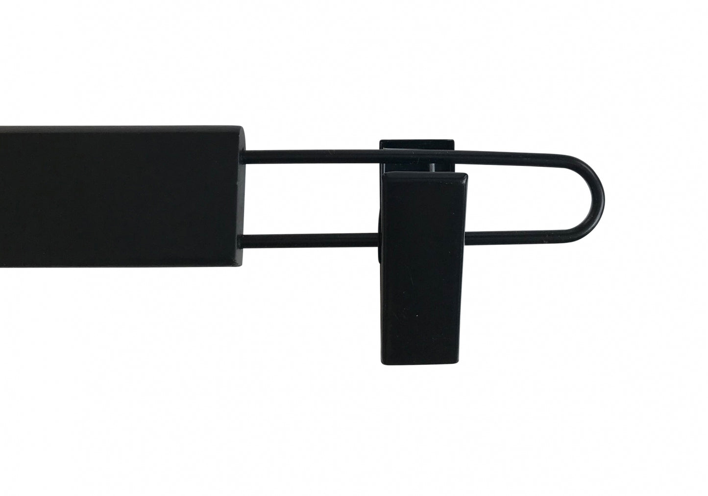 A Black Wooden Clip Bottom Hanger 37cm by Hangers of London on a white background. The hanger extends outward from the main body, a rectangular block, and curves back inward at the end. A small sturdy clip is attached near the curved end. The design allows for versatile use with 360-degree rotation capabilities.