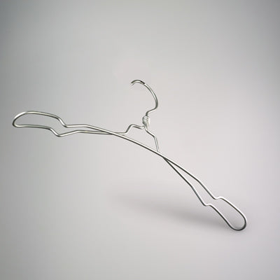 A minimalist, silver-colored wire hanger with a smooth and slightly curved design is placed against a plain gray background. This Hangers of London Natural Aluminium Top Notch Coat Hanger 40cm has a simple hook at the top and is slightly elevated, casting a faint shadow below, making it perfect for wardrobe organization.