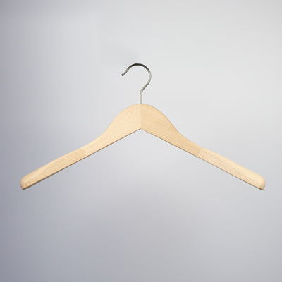 A durable wooden hanger with a metal hook is suspended against a plain, light gray background. The Hangers of London Natural Wooden Jacket Top Coat Hanger 44cm boasts a smooth finish and natural wood color, forming an inverted V shape with slightly curved arms, ideal for garment care.